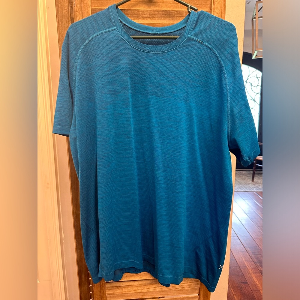 Lululemon XXL. New without tags. Aqua/gray two tone shirt.